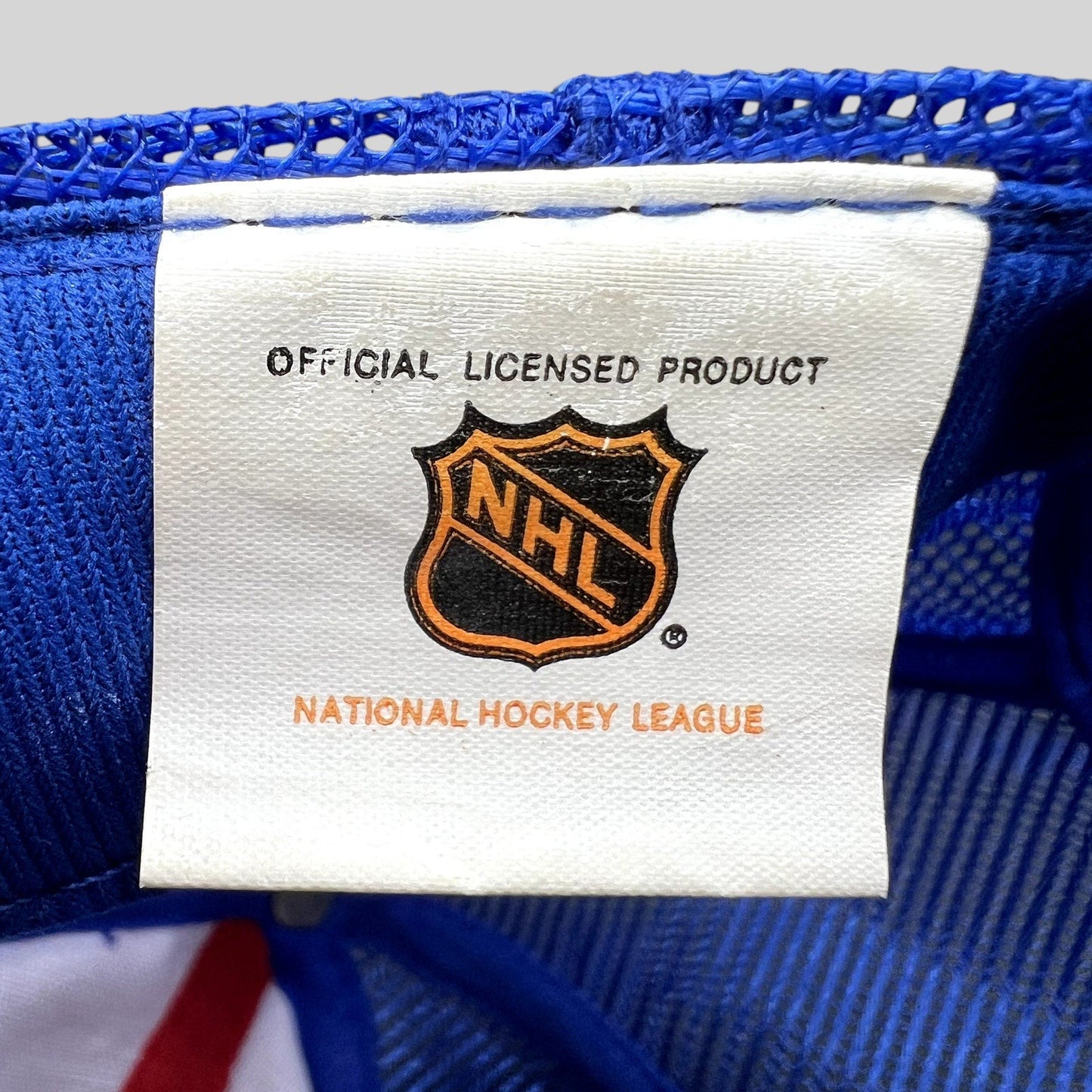 Raree Finds vintage Montreal Canadiens NHL official licensed product tag on a blue mesh trucker hat