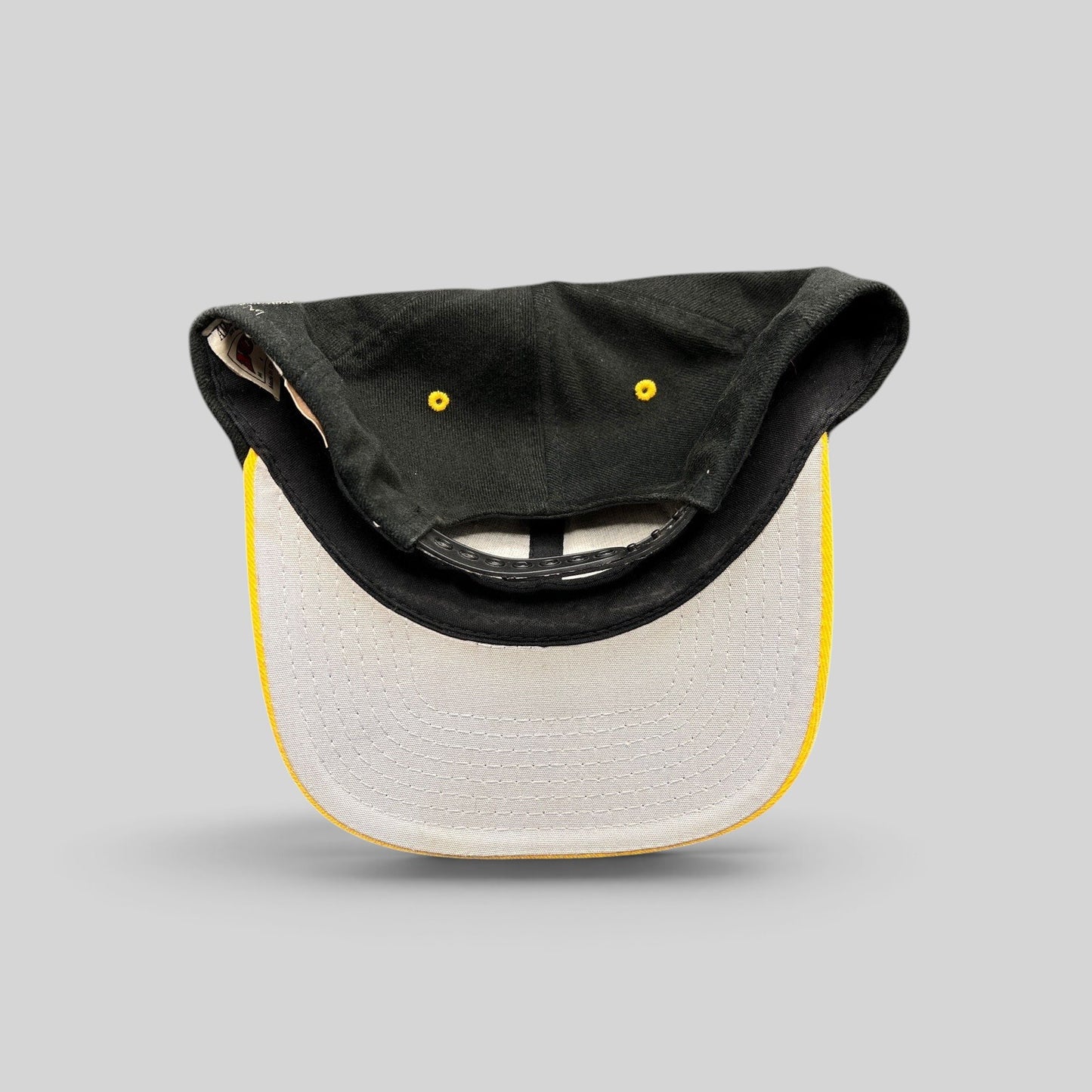 Raree Finds vintage Pittsburgh Steelers Nutmeg Mills snapback hat showing the gray underbrim and plastic closure