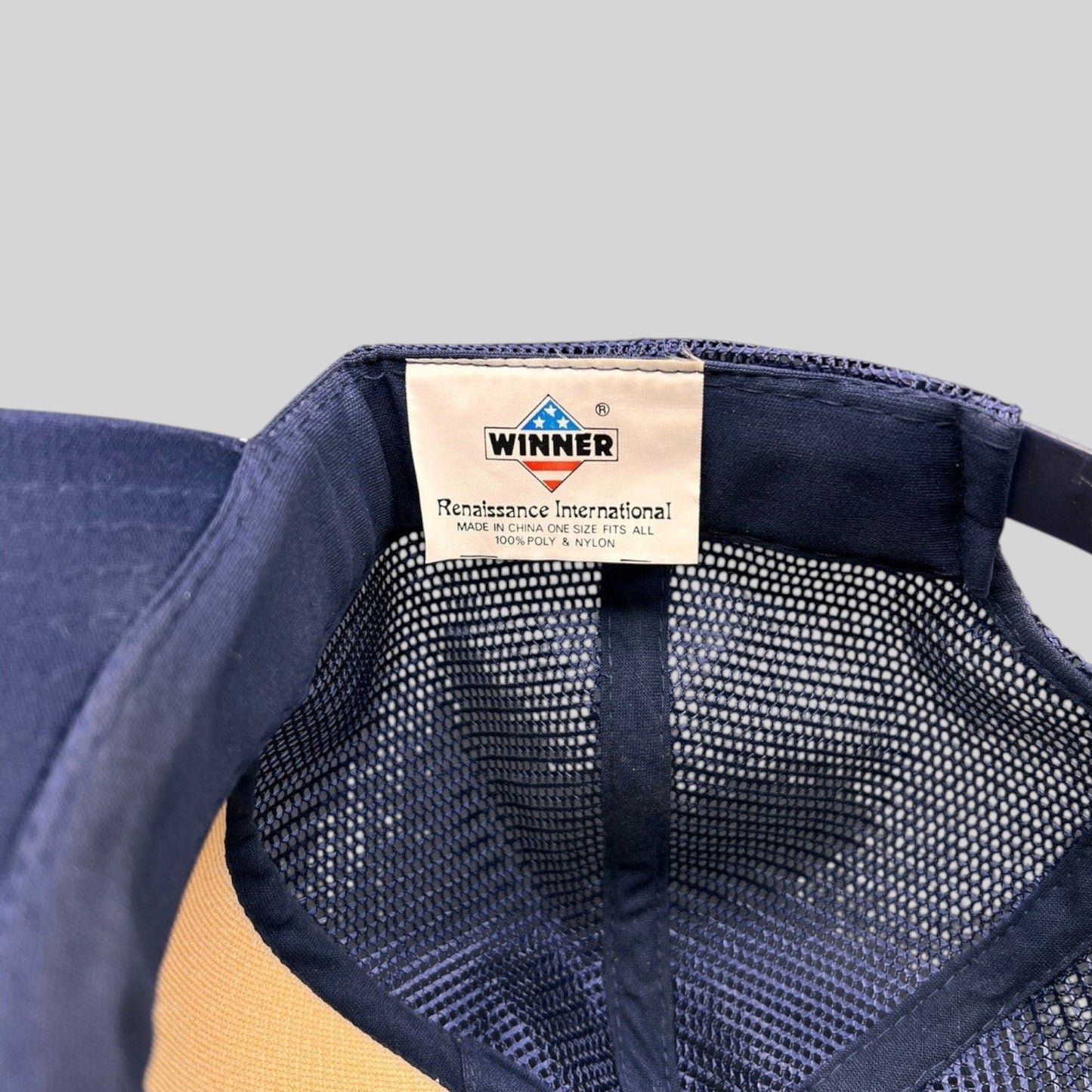 Raree Finds vintage Winner Renaissance International trucker hat interior label showing brand and material details