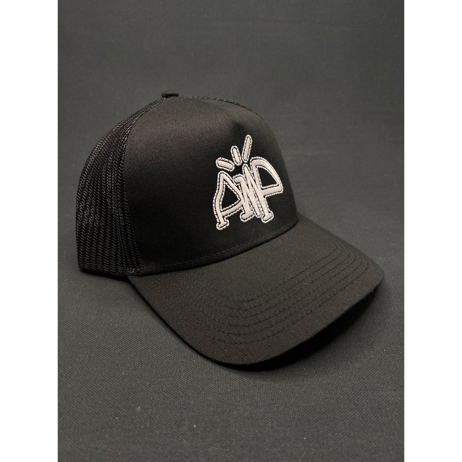 AMP Logo Black Mesh Trucker Hat – Adjustable Snapback