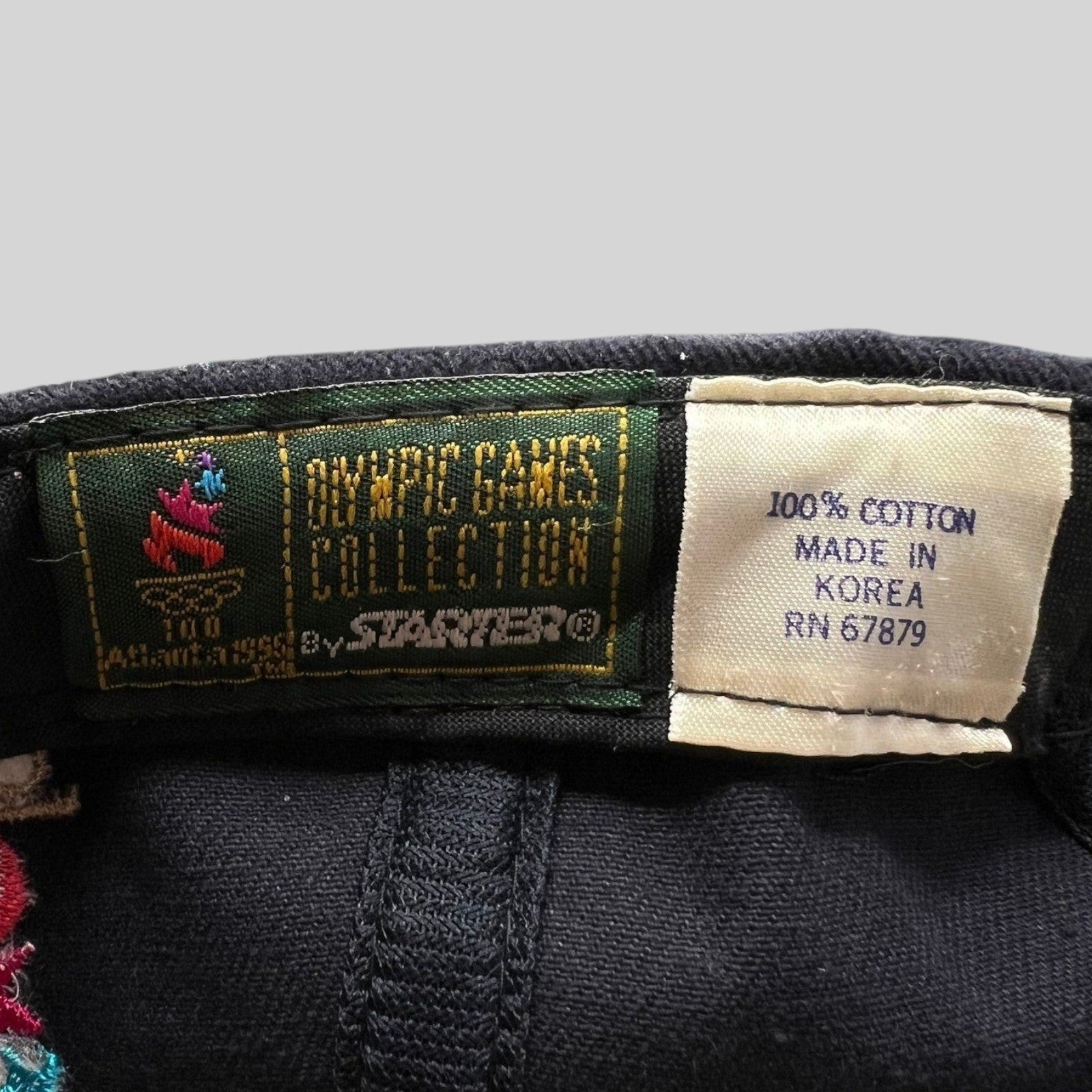 Raree Finds vintage 1996 Atlanta Olympics Starter hat interior label showing 100% cotton and made in Korea details