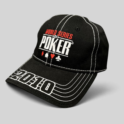 Raree Finds black 2010 World Series of Poker flexfit hat with embroidered logo, card suits, and brim stitching.