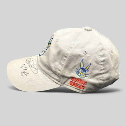Raree Finds cream cotton New Orleans Baby Cakes strapback hat with Bunny Bread embroidery and signed brim