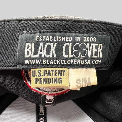 Raree Finds Black Clover cap interior label showing brand logo, patent pending status, and size S/M tag