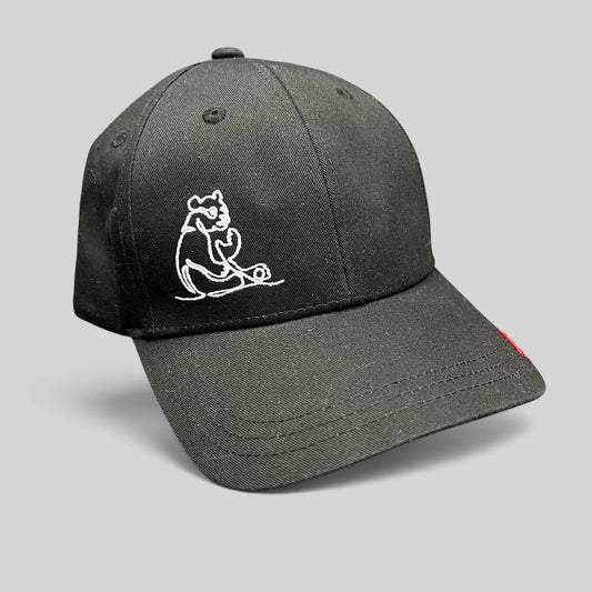 Raree Finds black six-panel strapback hat featuring a minimalist white embroidered panda graphic.