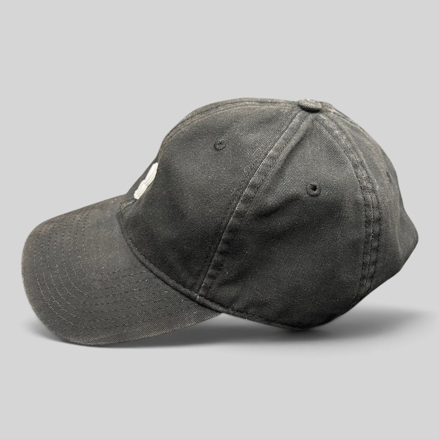 Raree Finds black cotton strapback hat featuring a minimalist metal Playboy bunny logo on the front crown
