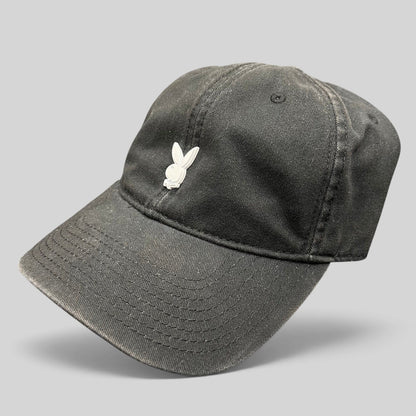 Raree Finds black cotton strapback hat featuring a minimalist raised metal Playboy bunny logo on the front crown.