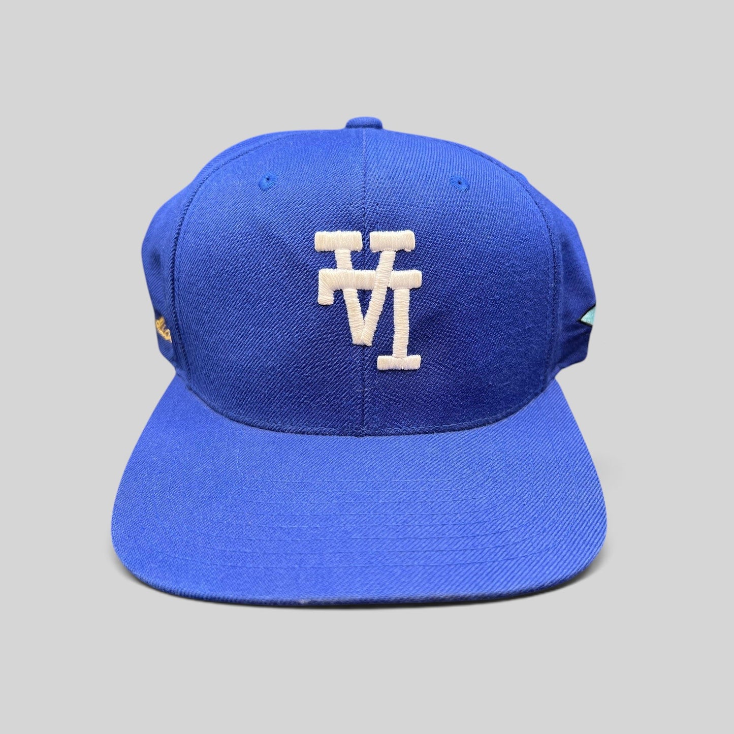 Raree Finds royal blue Uniform Studios Los Angeles snapback hat with white embroidered logo and green undervisor