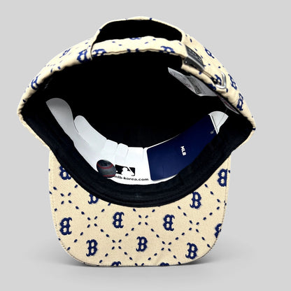 Raree Finds MLB Korea Boston Red Sox strapback hat in beige with blue monogram pattern and adjustable metal closure.