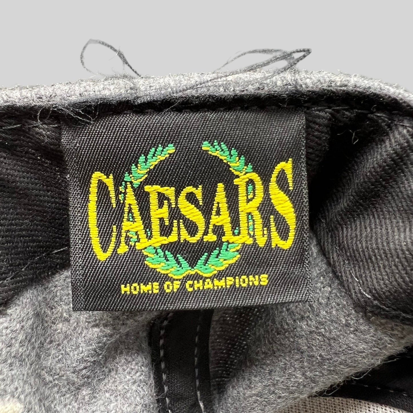 Raree Finds vintage Caesars Home of Champions embroidered brand label inside a grey wool-blend snapback hat