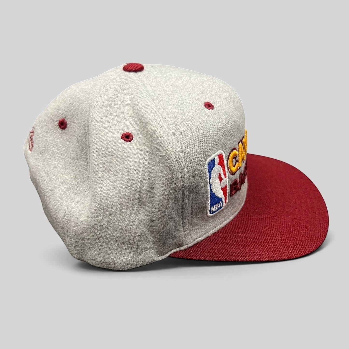 Raree Finds Mitchell & Ness Cleveland Cavaliers NBA snapback hat featuring a heather gray crown and wine red brim.