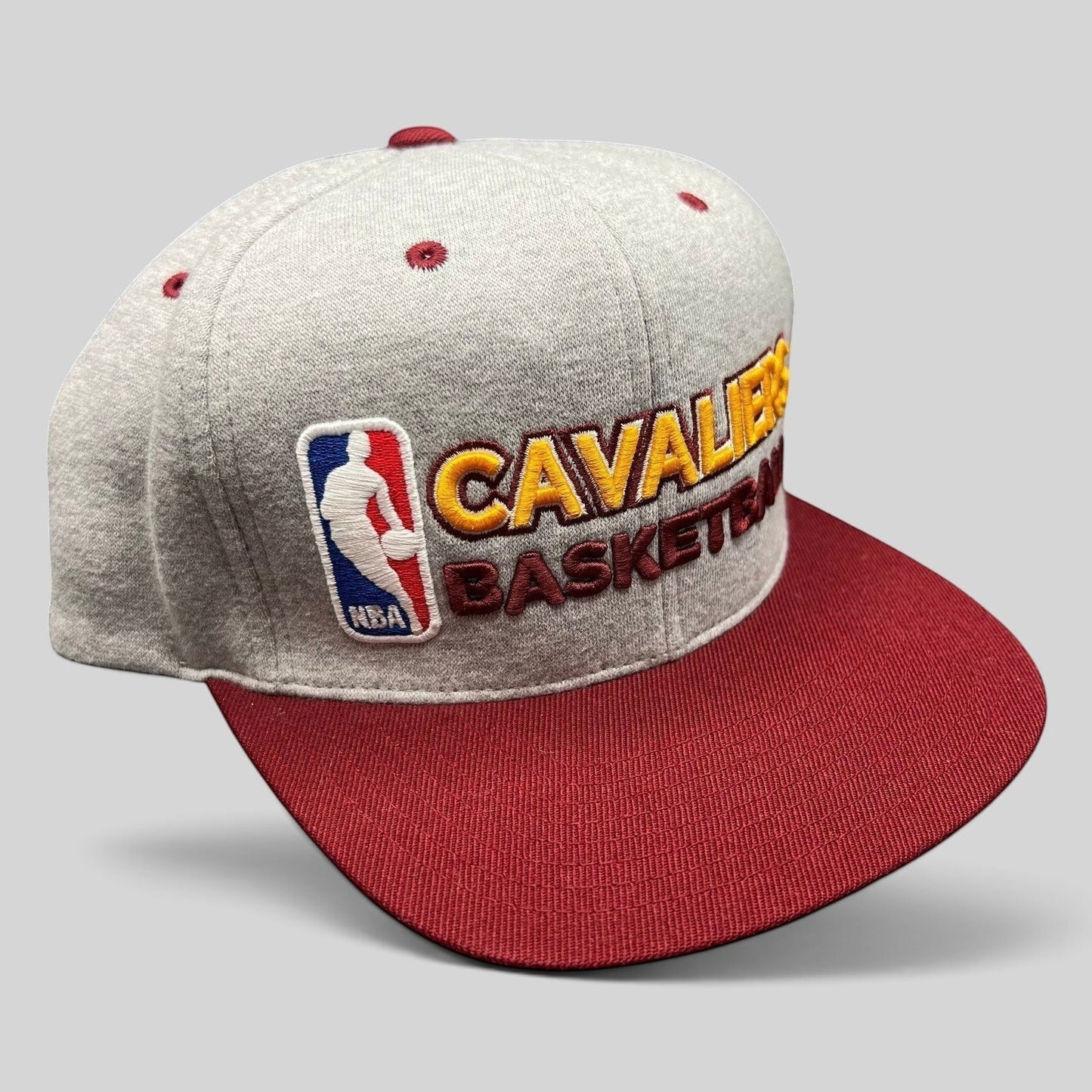 Raree Finds Mitchell & Ness Cleveland Cavaliers NBA snapback hat featuring a heather gray crown and wine red brim.