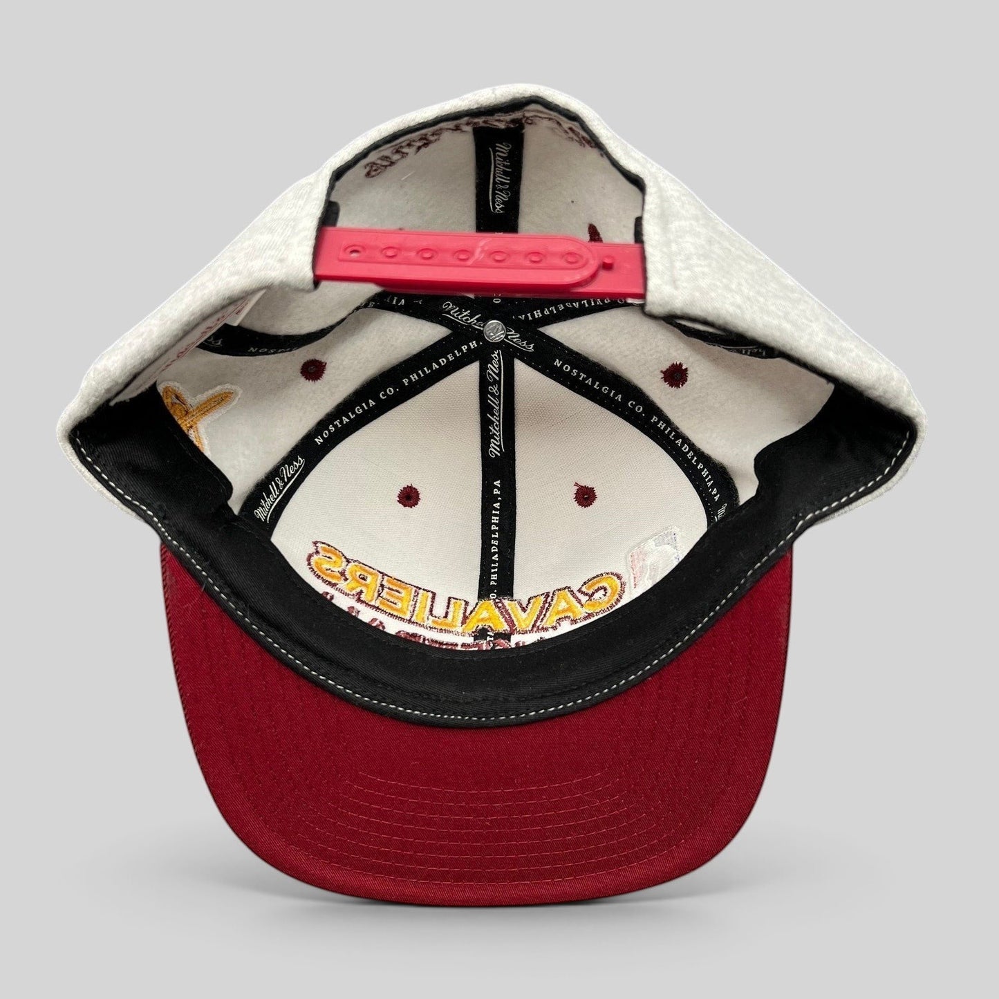 Raree Finds Mitchell & Ness Cleveland Cavaliers snapback hat interior view showing branding and red snap closure