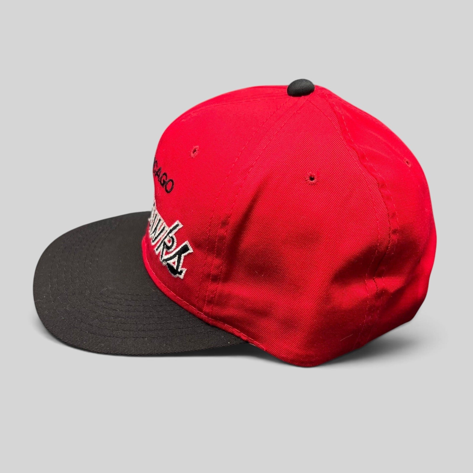 Raree Finds vintage 90s Chicago Blackhawks Sports Specialties snapback hat with red crown, black brim, and script logo.