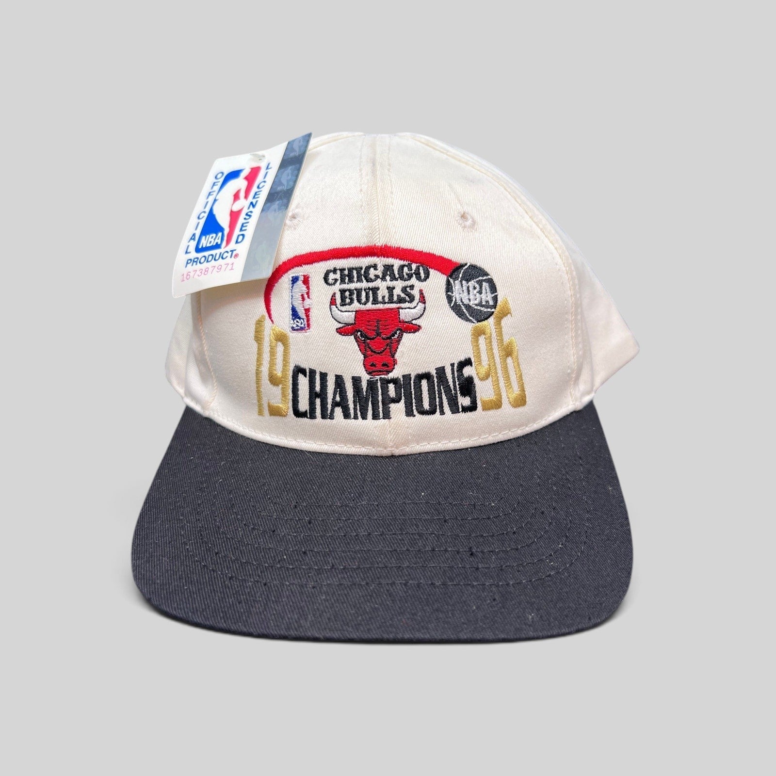 Raree Finds vintage 1996 Chicago Bulls NBA Champions snapback hat with cream crown, black brim, and embroidered logo.