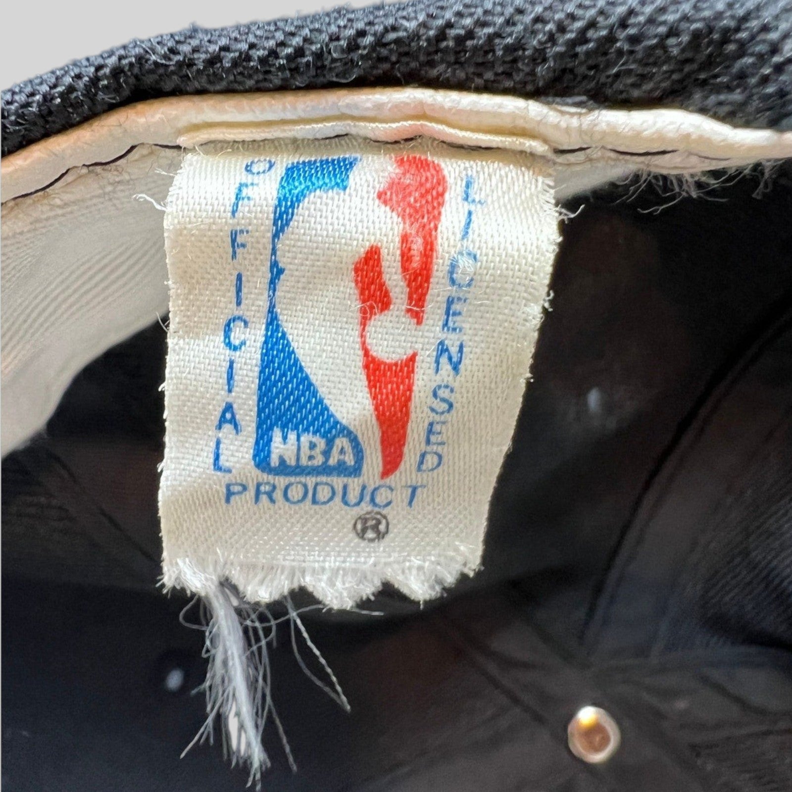 Raree Finds vintage 90s Chicago Bulls snapback hat featuring an official NBA licensed product tag inside the crown.