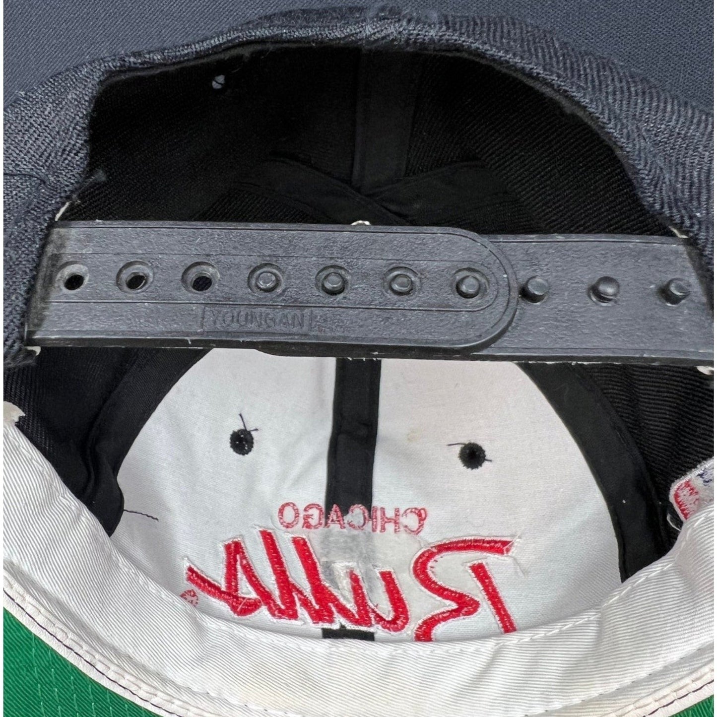 Raree Finds vintage 90s Chicago Bulls snapback hat showing the interior Youngan adjustable plastic strap and branding