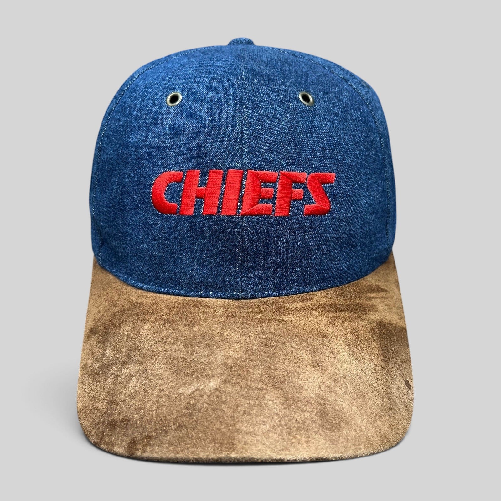 Raree Finds vintage Kansas City Chiefs snapback hat with blue denim crown, brown suede bill, and red embroidery.