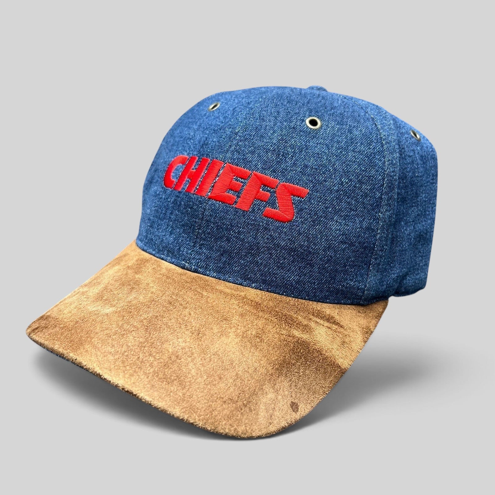 Raree Finds vintage Kansas City Chiefs snapback hat with blue denim crown, brown suede bill, and red embroidery.
