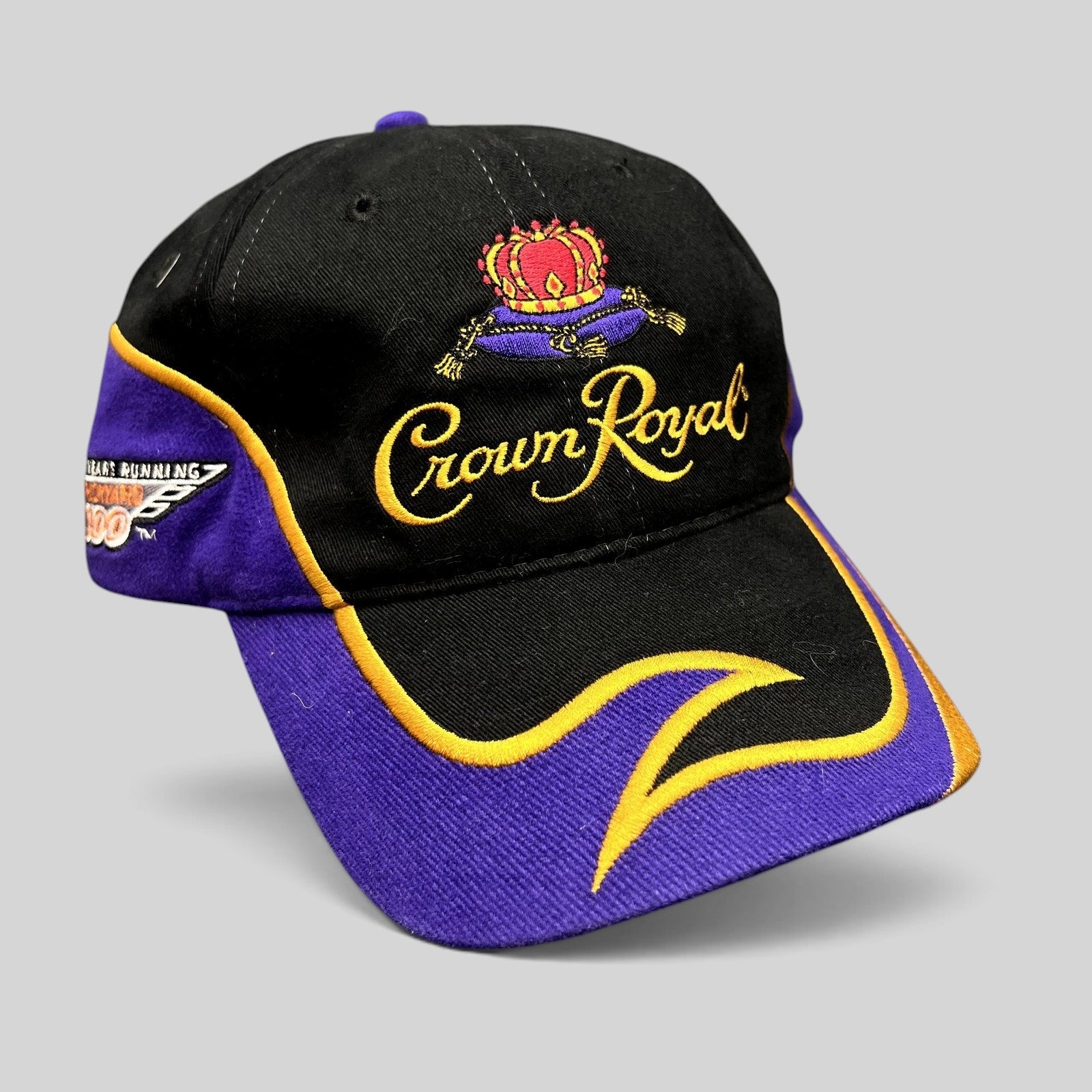 Raree Finds vintage 2003 Crown Royal Roots strapback hat in black and purple with gold embroidered logo and visor detail