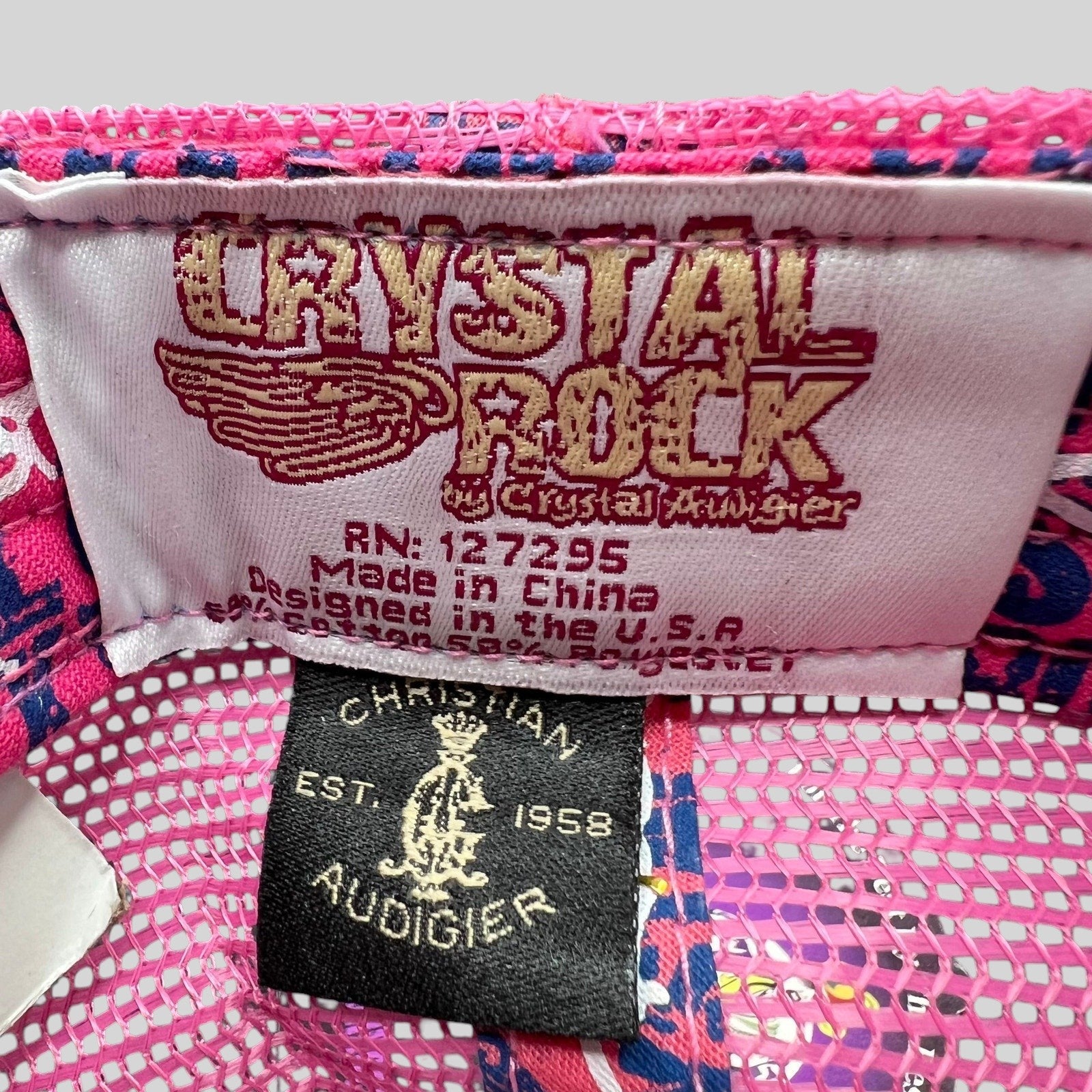 Raree Finds Crystal Rock by Christian Audigier trucker hat interior brand and care labels on pink mesh fabric