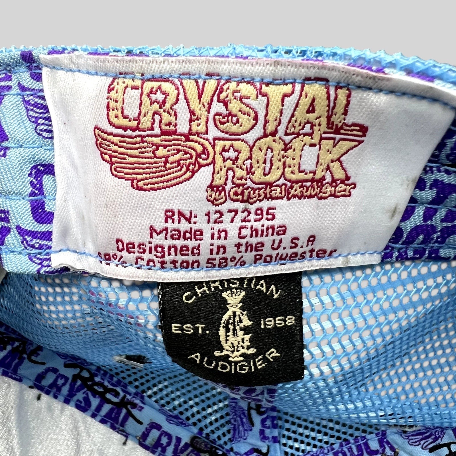 Raree Finds Crystal Rock by Christian Audigier trucker hat interior brand and care labels with blue mesh backing