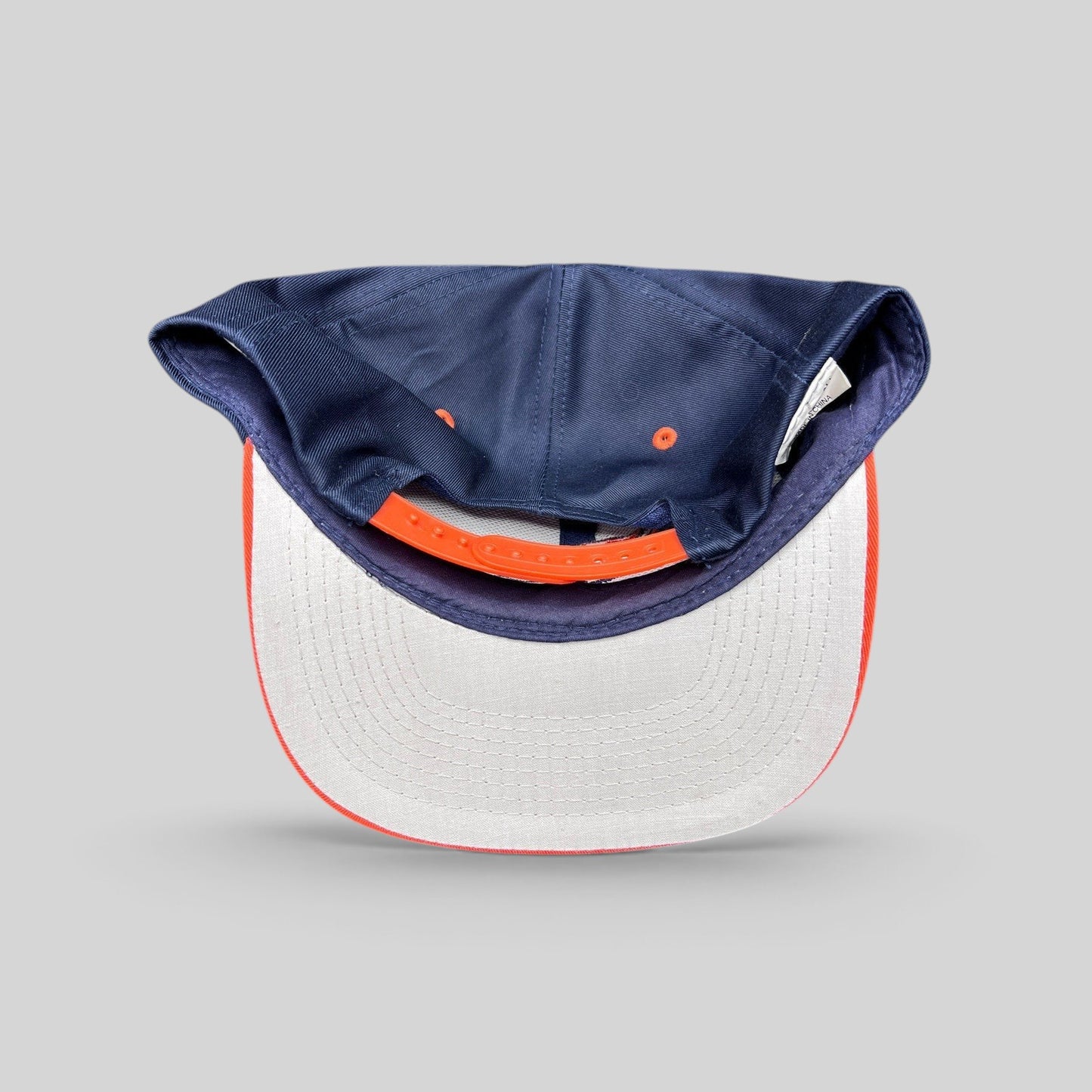 Raree Finds vintage Denver Broncos Logo Athletic snapback hat showing the interior gray undervisor and orange strap.