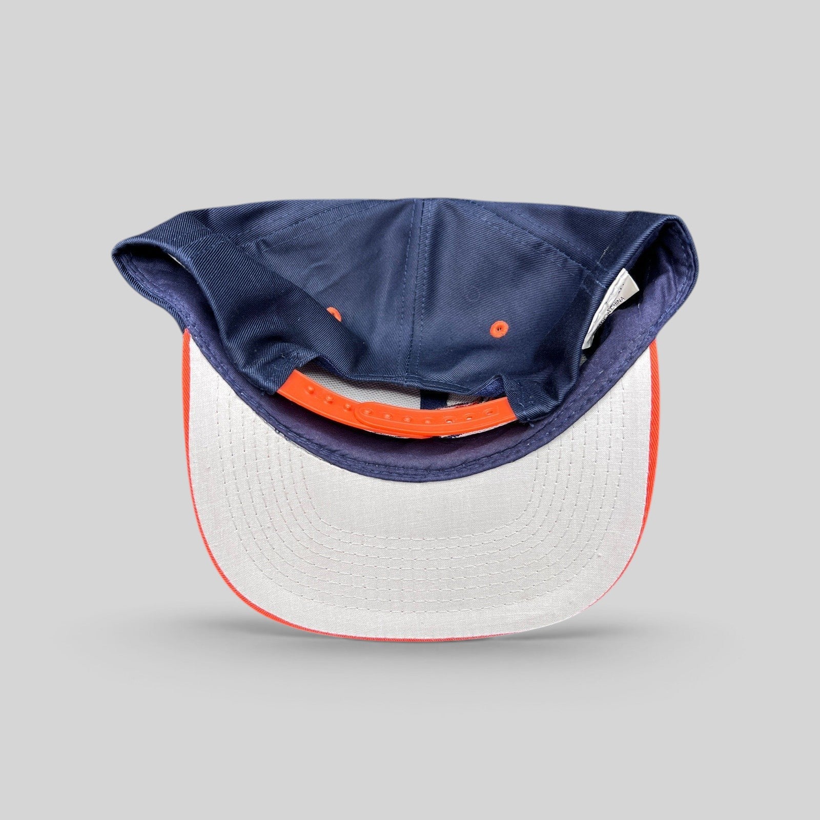 Raree Finds vintage Denver Broncos Logo Athletic snapback hat showing the interior gray undervisor and orange strap.