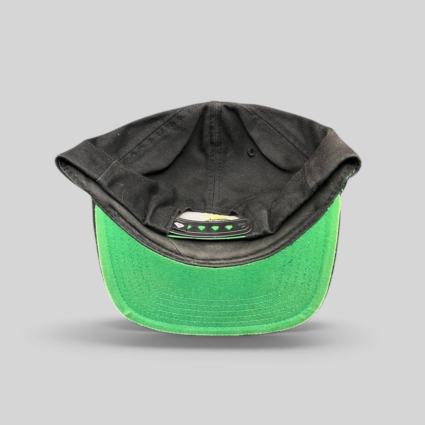 Raree Finds vintage Diamond Supply Co. black snapback hat with a green underbrim and branded snap closure