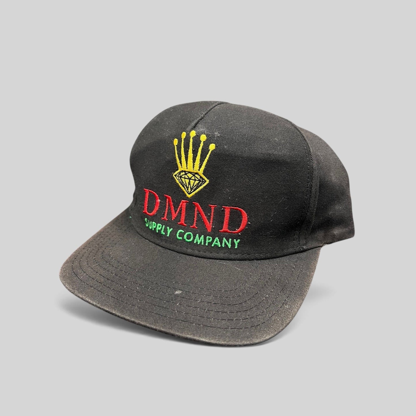 Raree Finds vintage Diamond Supply Co. black snapback hat with red, yellow, and green crown and diamond embroidery.