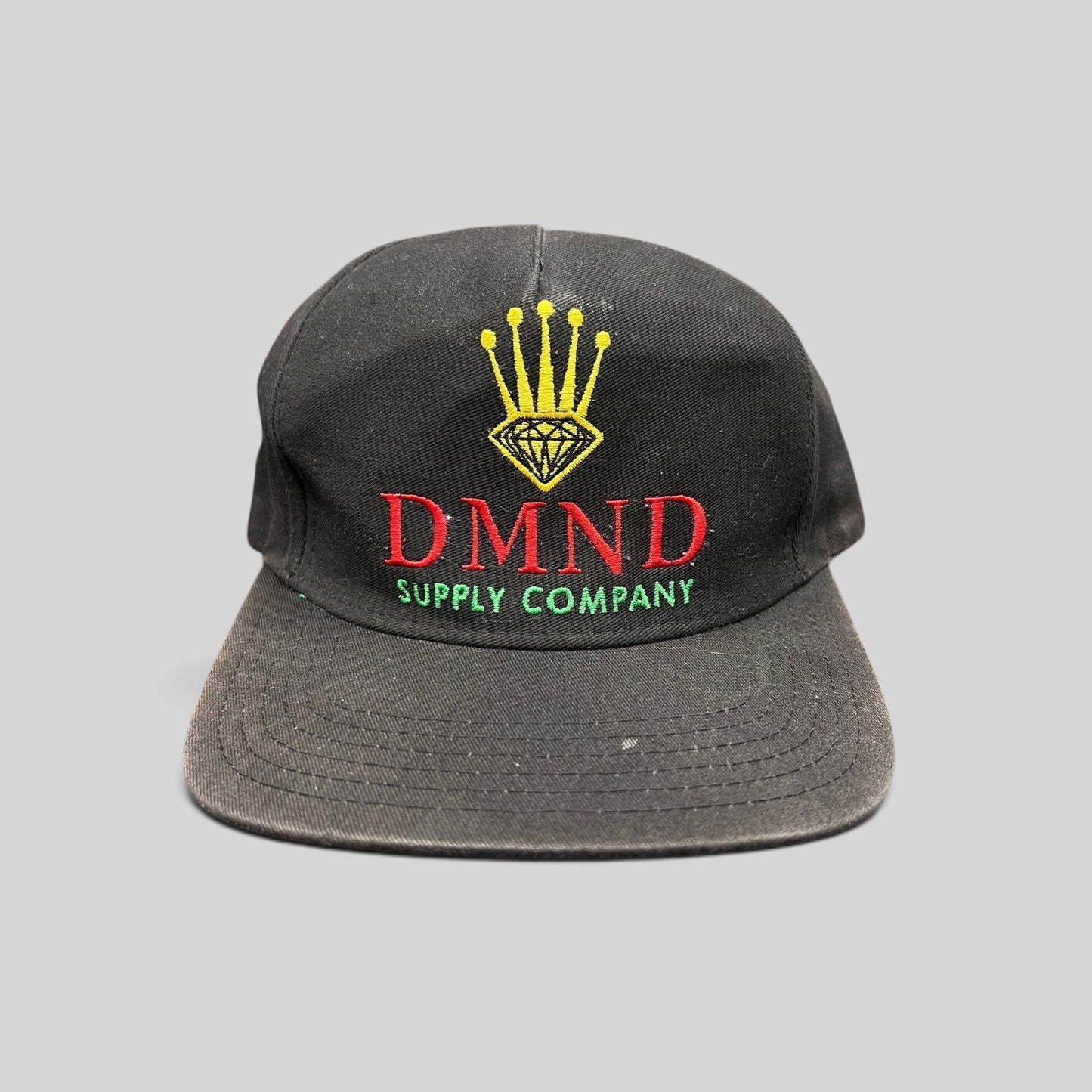 Raree Finds vintage Diamond Supply Co. black snapback hat with red, yellow, and green crown and diamond embroidery.