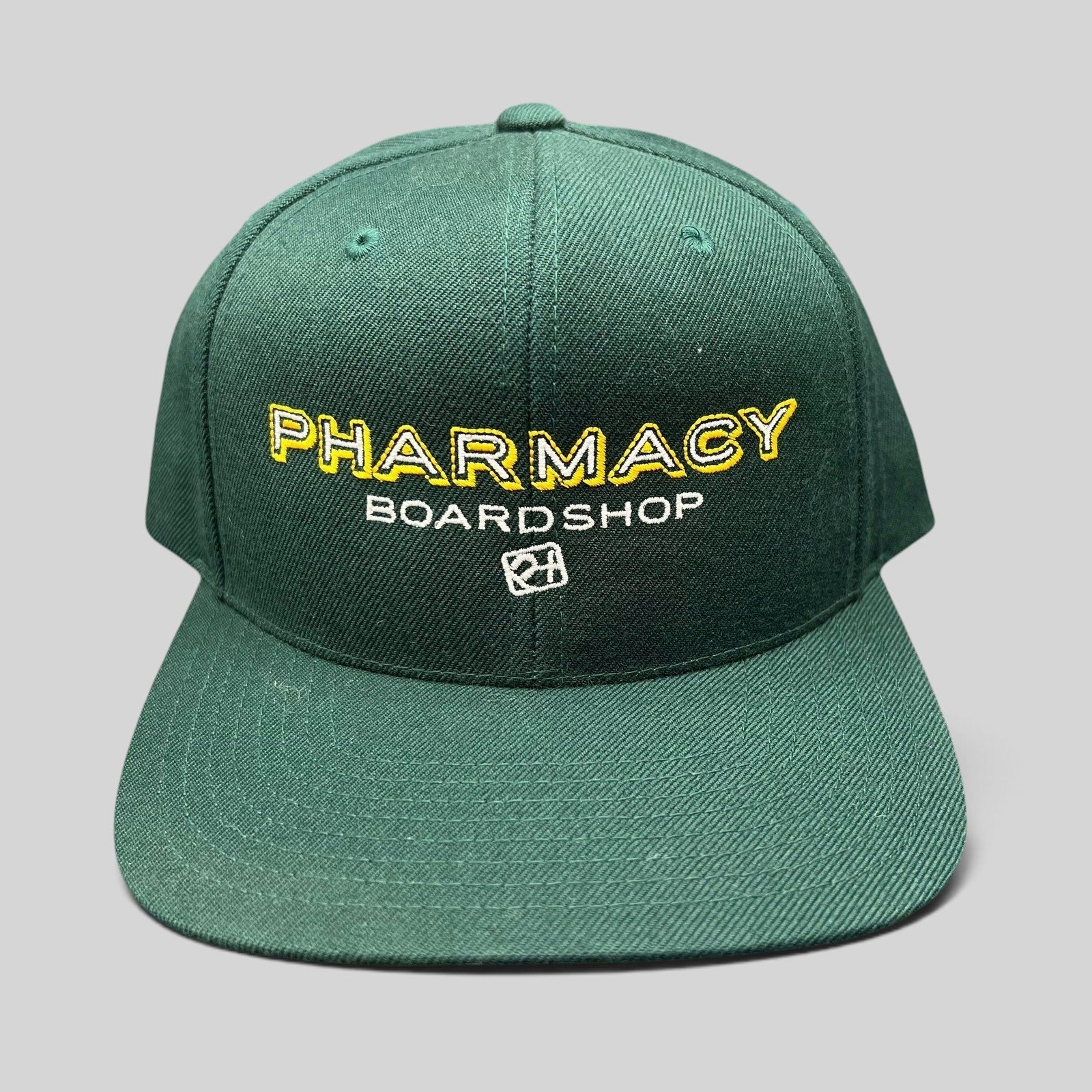 Raree Finds vintage forest green Pharmacy Boardshop snapback hat with yellow and white embroidered skate branding