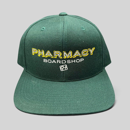 Raree Finds vintage forest green Pharmacy Boardshop snapback hat with yellow and white embroidered skate branding