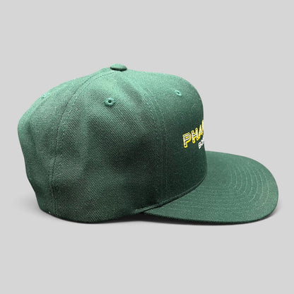 Raree Finds vintage forest green Pharmacy Boardshop snapback hat with structured crown and flat bill