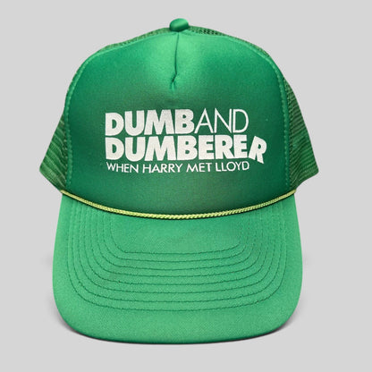 Raree Finds vintage green foam trucker hat with Dumb and Dumberer movie promo print and rope detail on the brim.