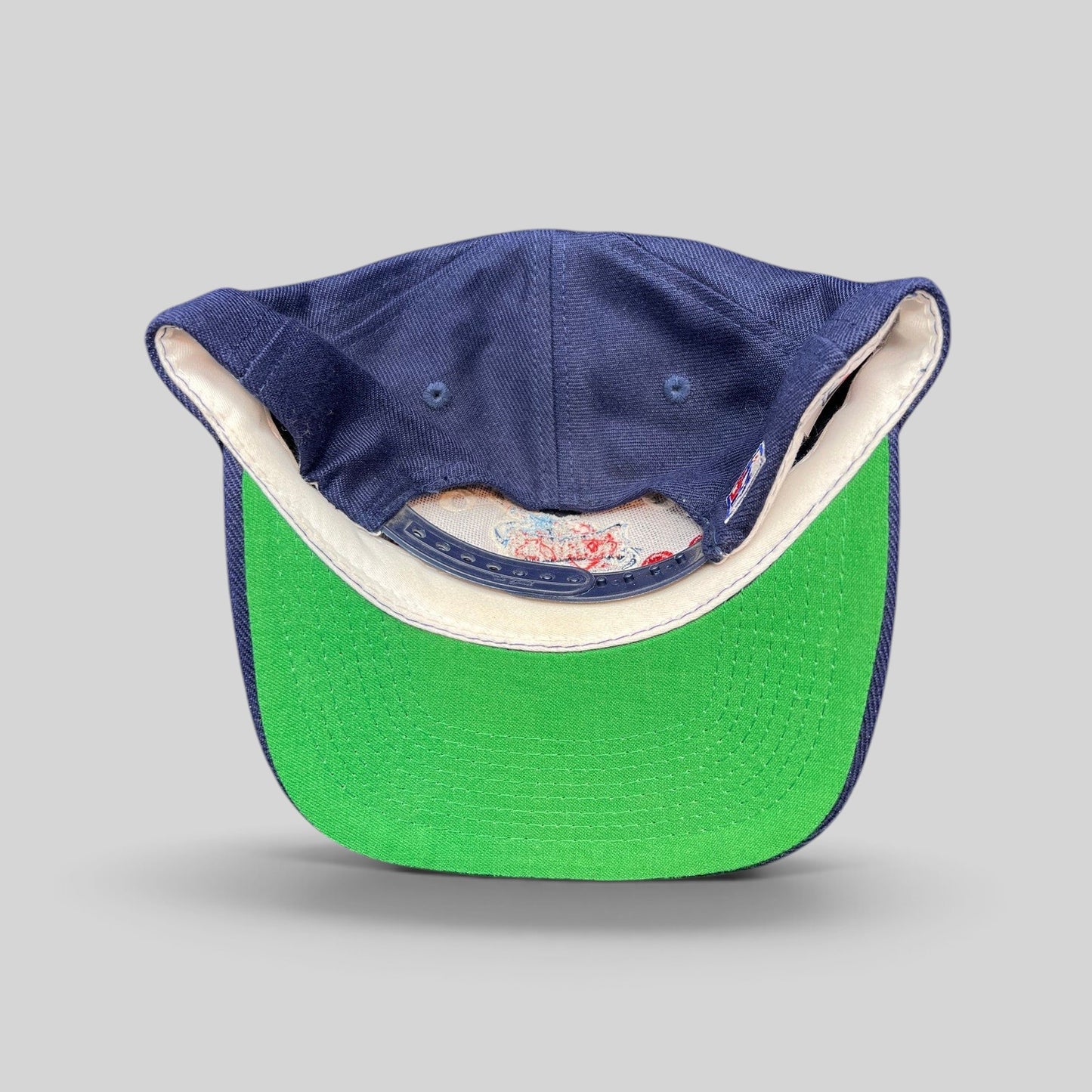 Raree Finds vintage 1990s Houston Rockets snapback hat by The Game featuring a navy crown and green undervisor