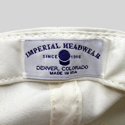 Raree Finds vintage Imperial Headwear label showing Denver Colorado and Made in USA text on a white golf hat