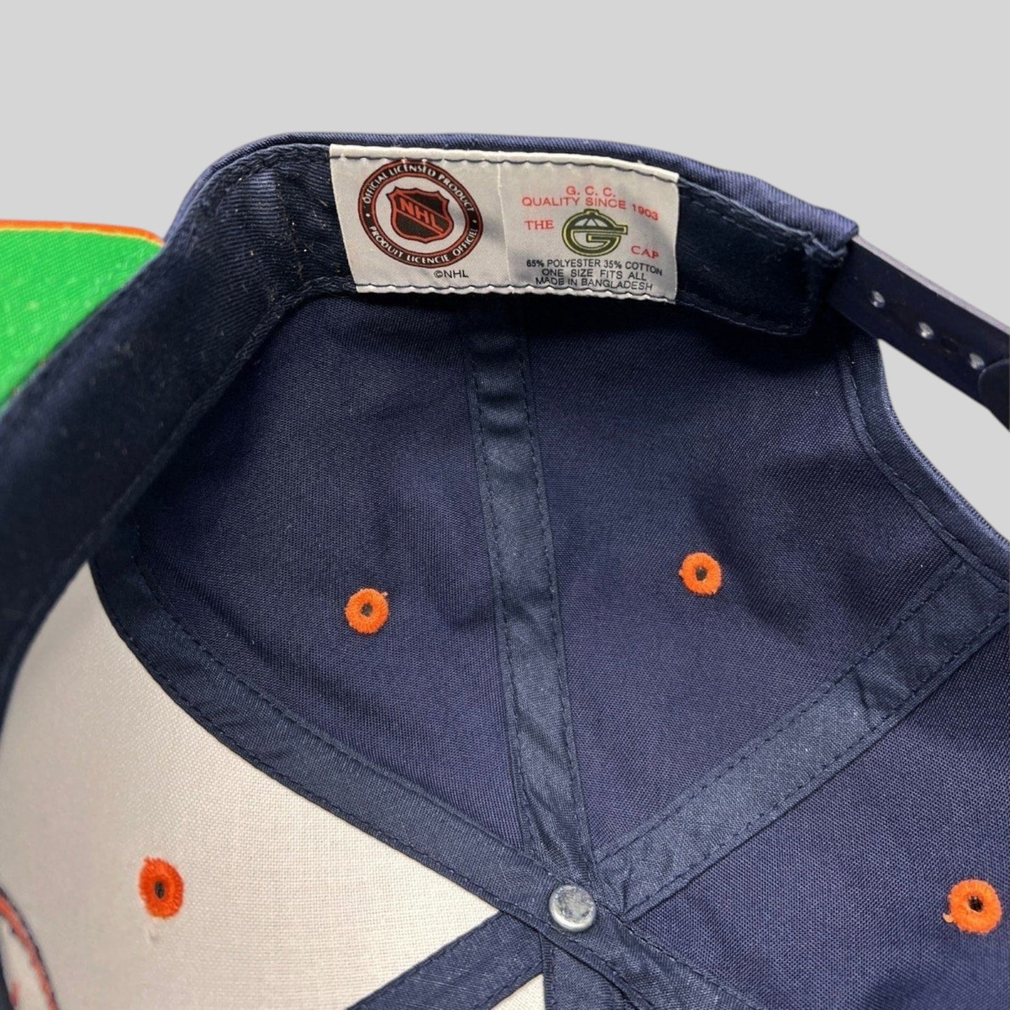 Raree Finds vintage New York Islanders snapback interior showing The G Cap brand tag and NHL licensing label