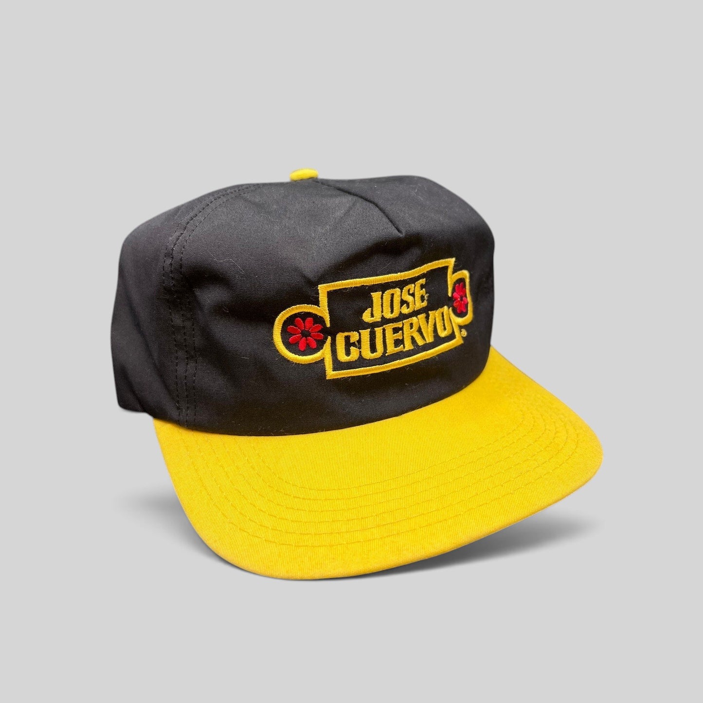 Raree Finds vintage Jose Cuervo black and yellow snapback hat with gold embroidered logo and floral accents