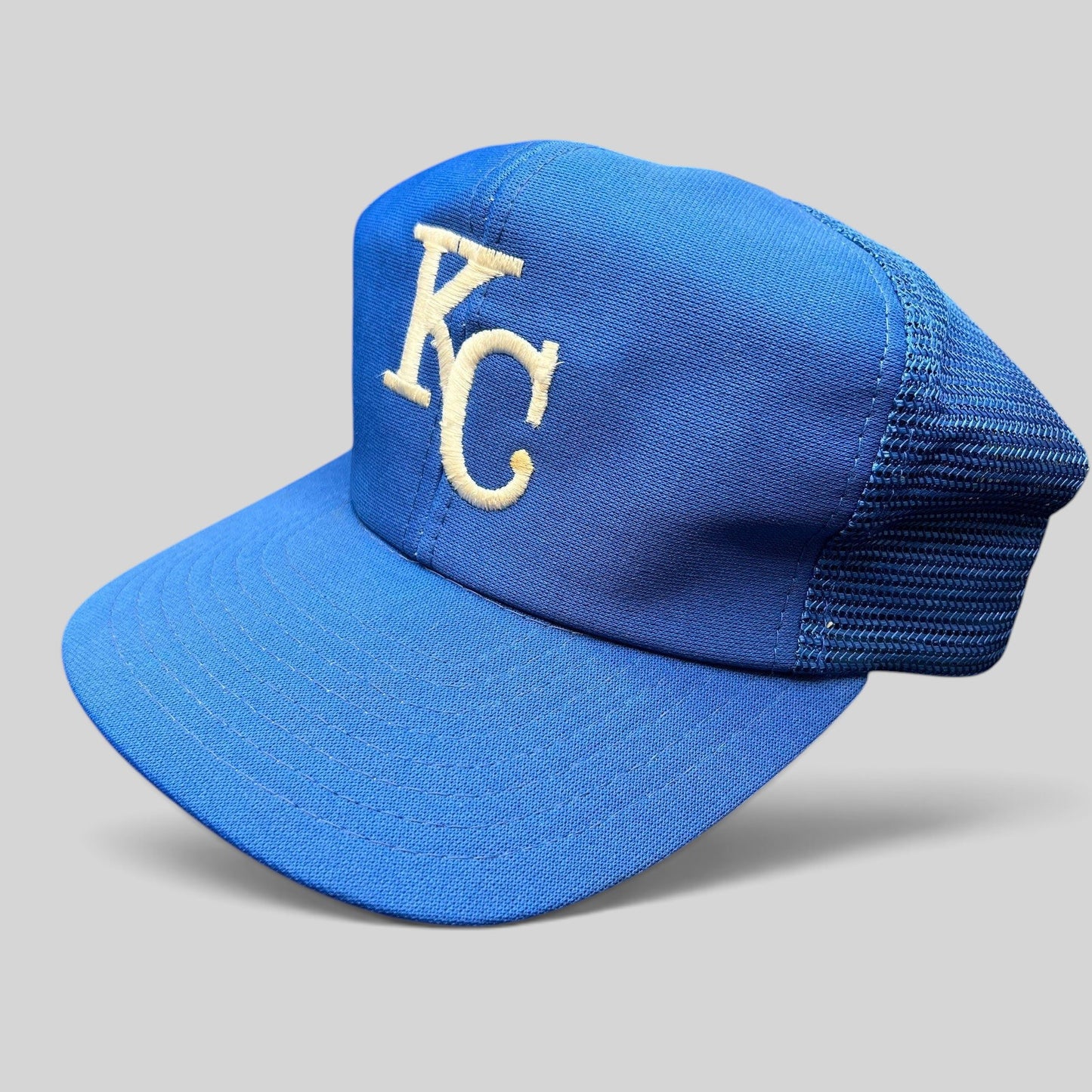 Raree Finds vintage Kansas City Royals trucker hat in royal blue with off-white KC embroidery and mesh back panels