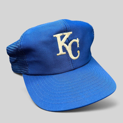 Raree Finds vintage Kansas City Royals trucker hat with royal blue foam front, mesh back, and off-white KC embroidery.