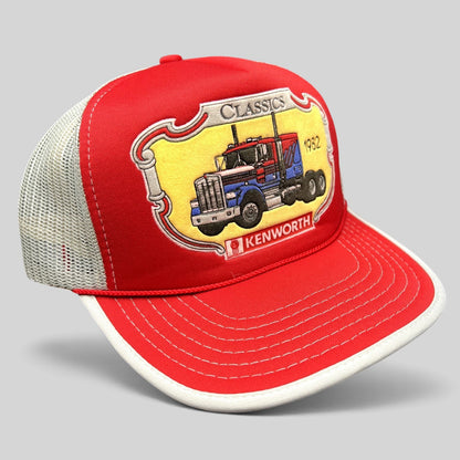 Raree Finds vintage 90s Kenworth Trucks trucker hat with red foam front, white mesh back, and 1982 semi-truck graphic.