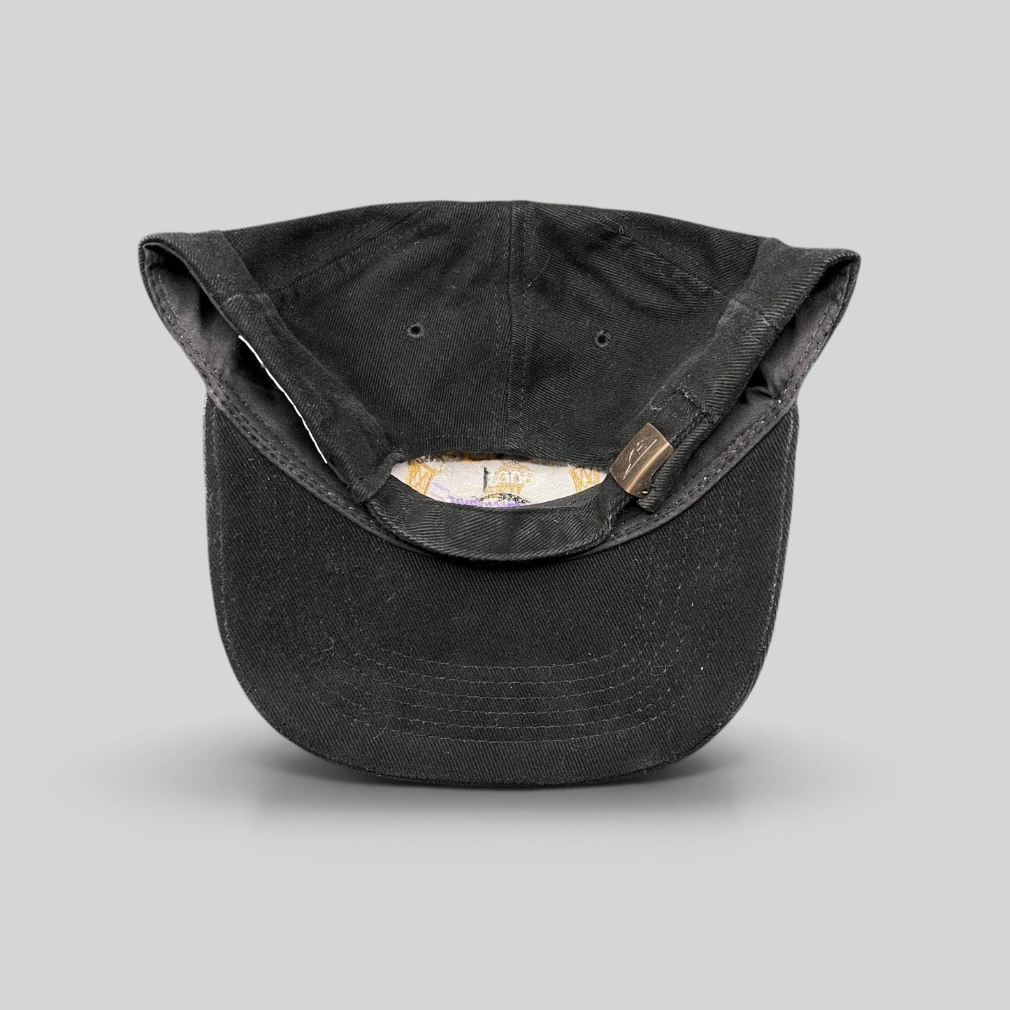 Raree Finds vintage black cotton Los Angeles Lakers 3-Peat championship hat showing the adjustable metal clasp strapback