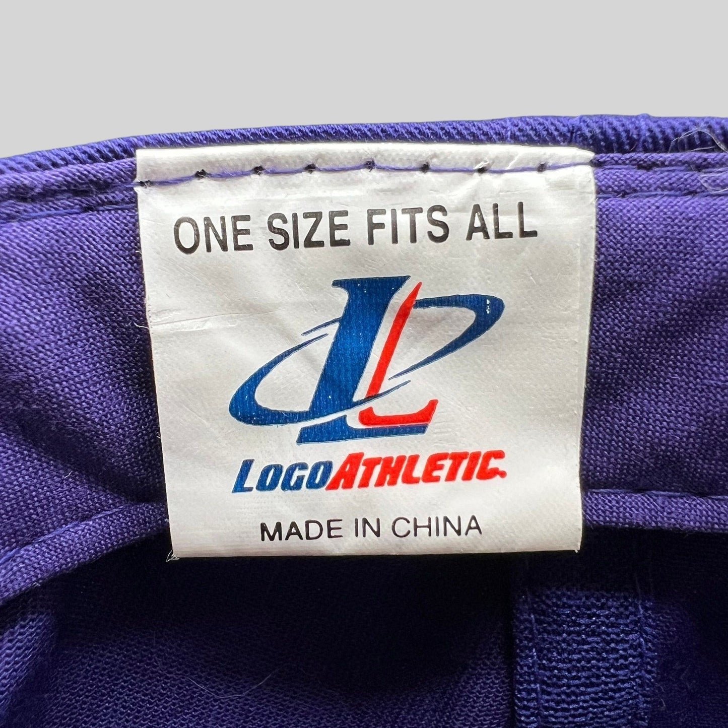 Raree Finds vintage Logo Athletic snapback hat interior tag showing brand logo and one size fits all label