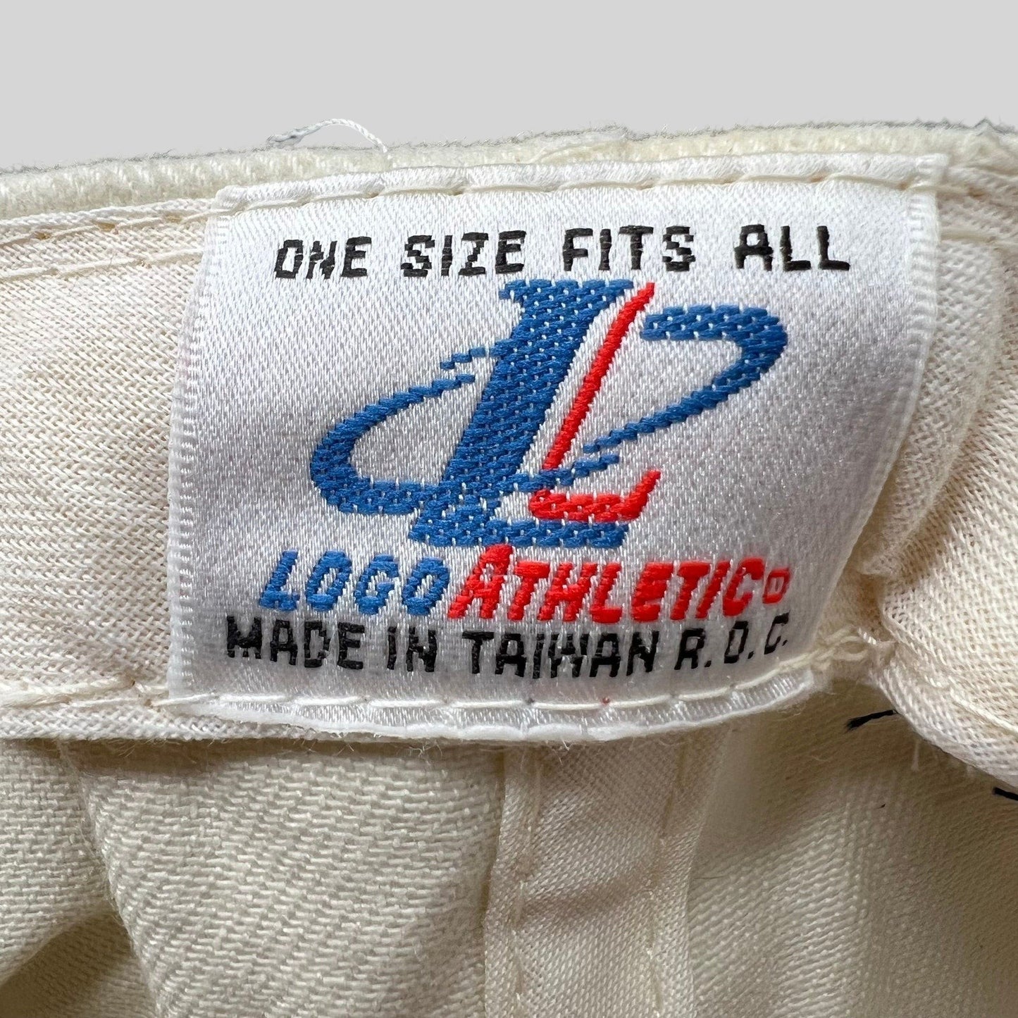 Raree Finds vintage Logo Athletic hat interior tag showing One Size Fits All and Made in Taiwan R.O.C. branding.