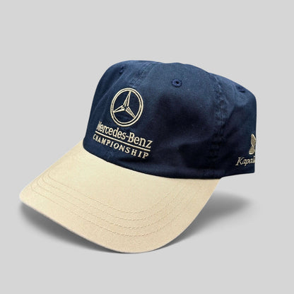 Raree Finds vintage Mercedes-Benz Championship golf hat with a navy cotton crown, tan brim, and embroidered logo.