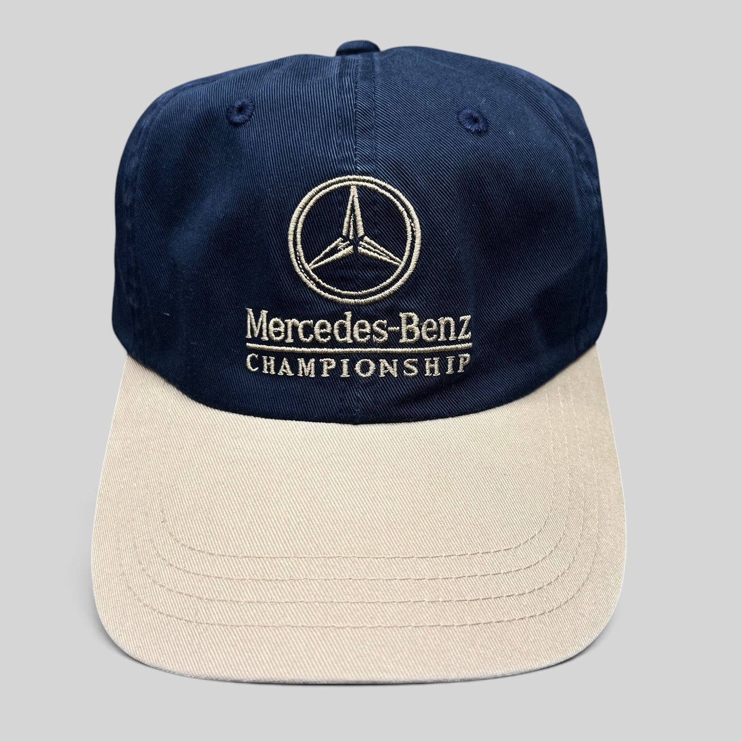 Raree Finds vintage navy and tan cotton Mercedes-Benz Championship golf strapback hat with embroidered logo