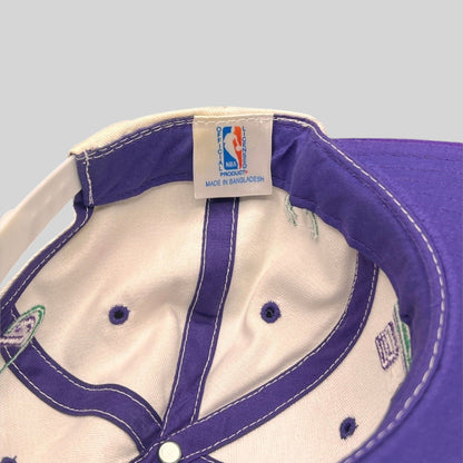 Raree Finds vintage Milwaukee Bucks snapback interior showing official NBA licensed product tag and purple lining