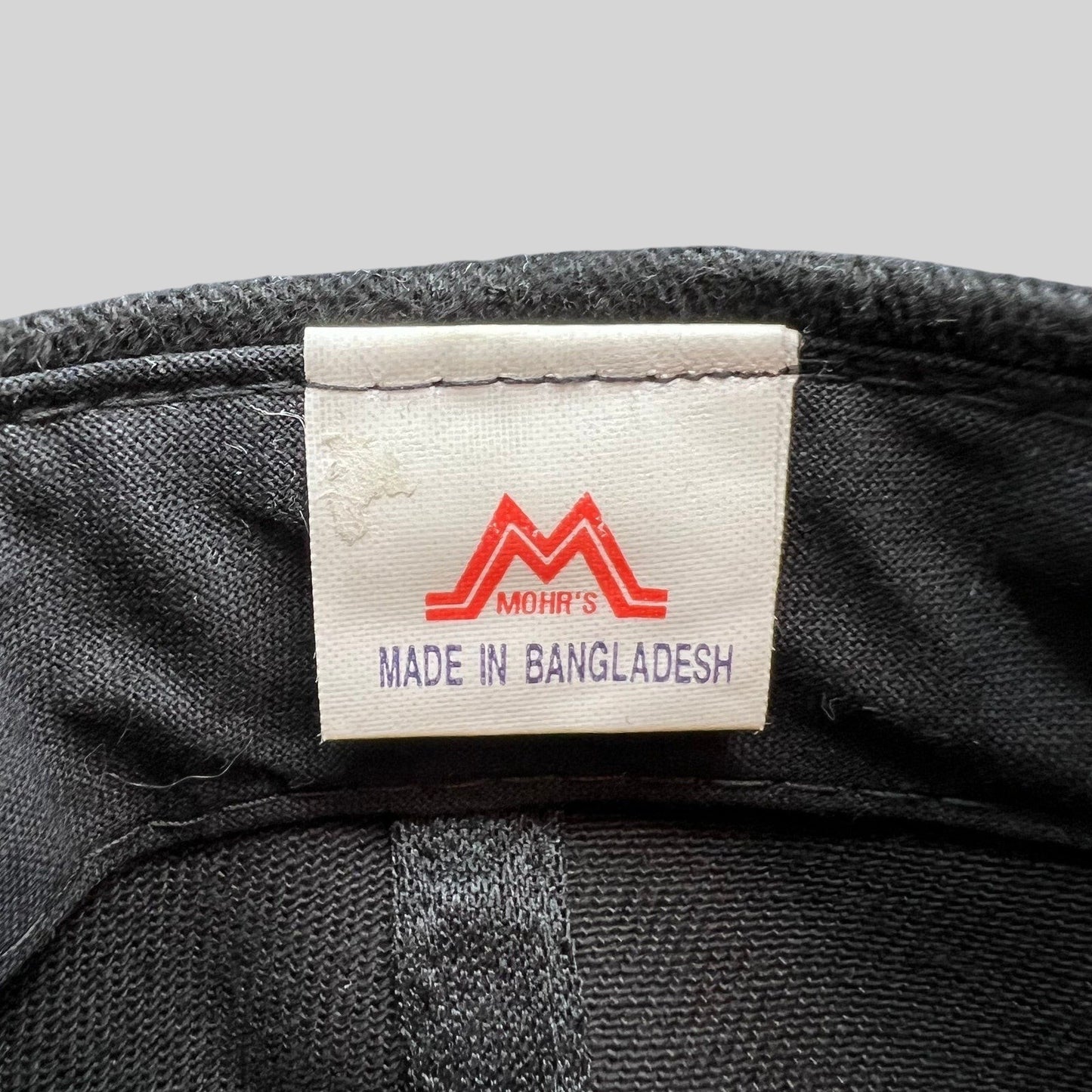 Raree Finds vintage Mission Impossible 2 hat interior tag showing Mohr's branding and Made in Bangladesh label.