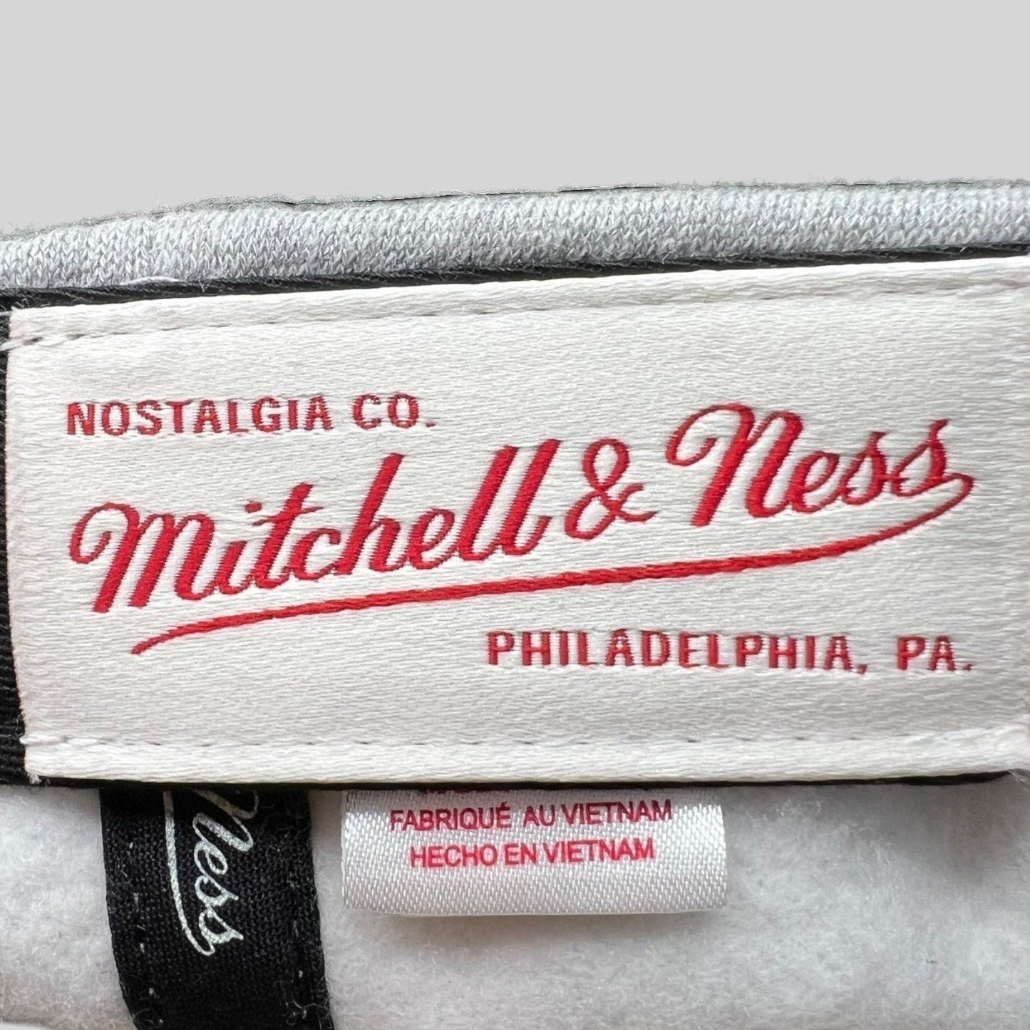 Raree Finds Mitchell & Ness Nostalgia Co. interior brand label and Vietnam origin tag inside a Cavaliers snapback hat.